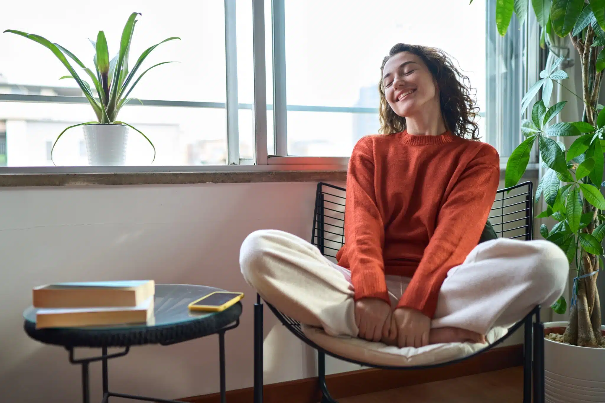 Woman wearing a custom nightguard while relaxing at home