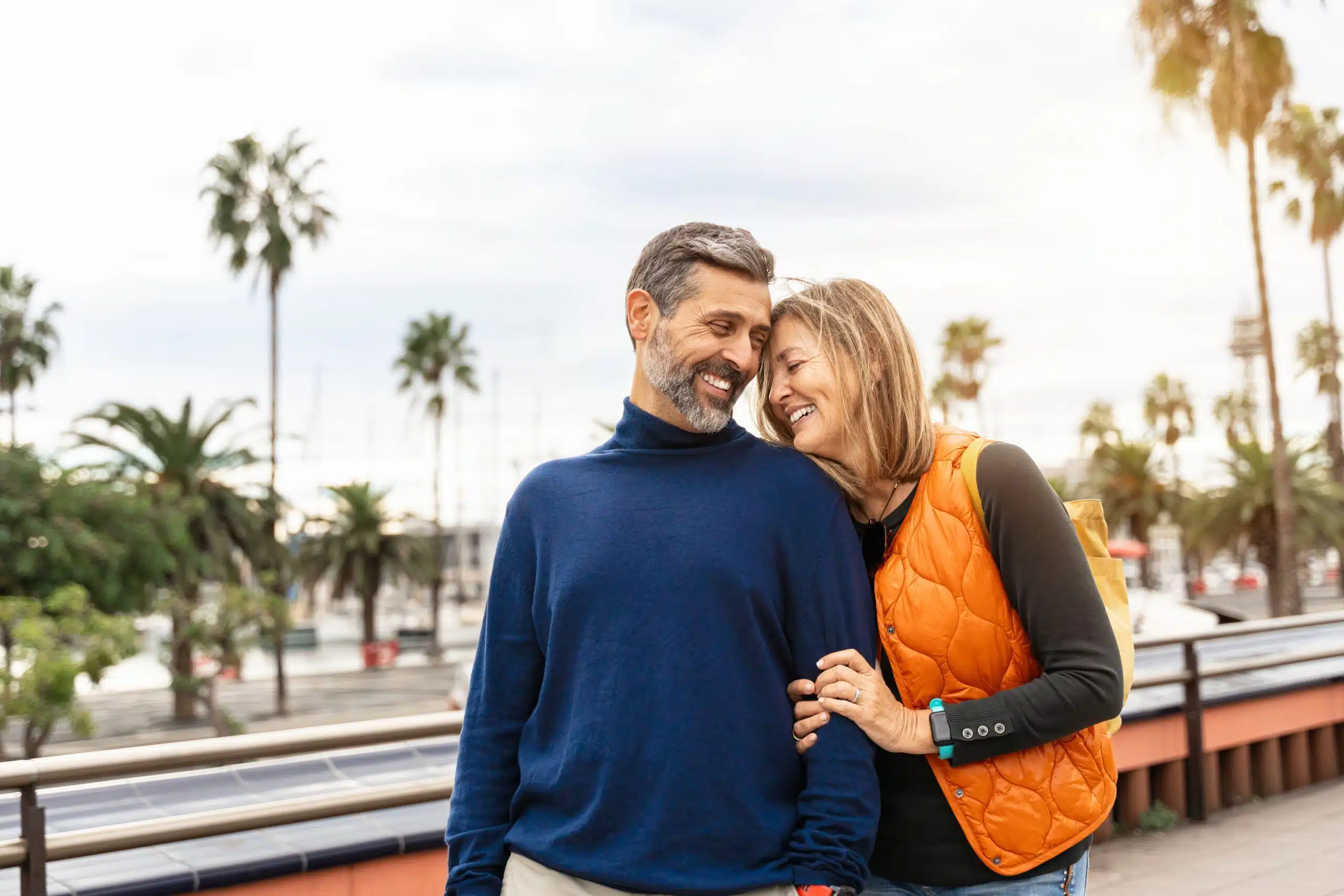 Smiling couple representing confidence and financial planning for dental care