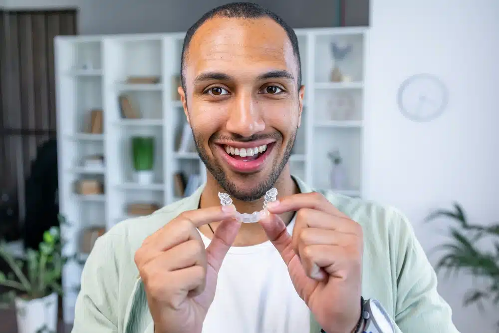 Man wearing Invisalign clear aligner