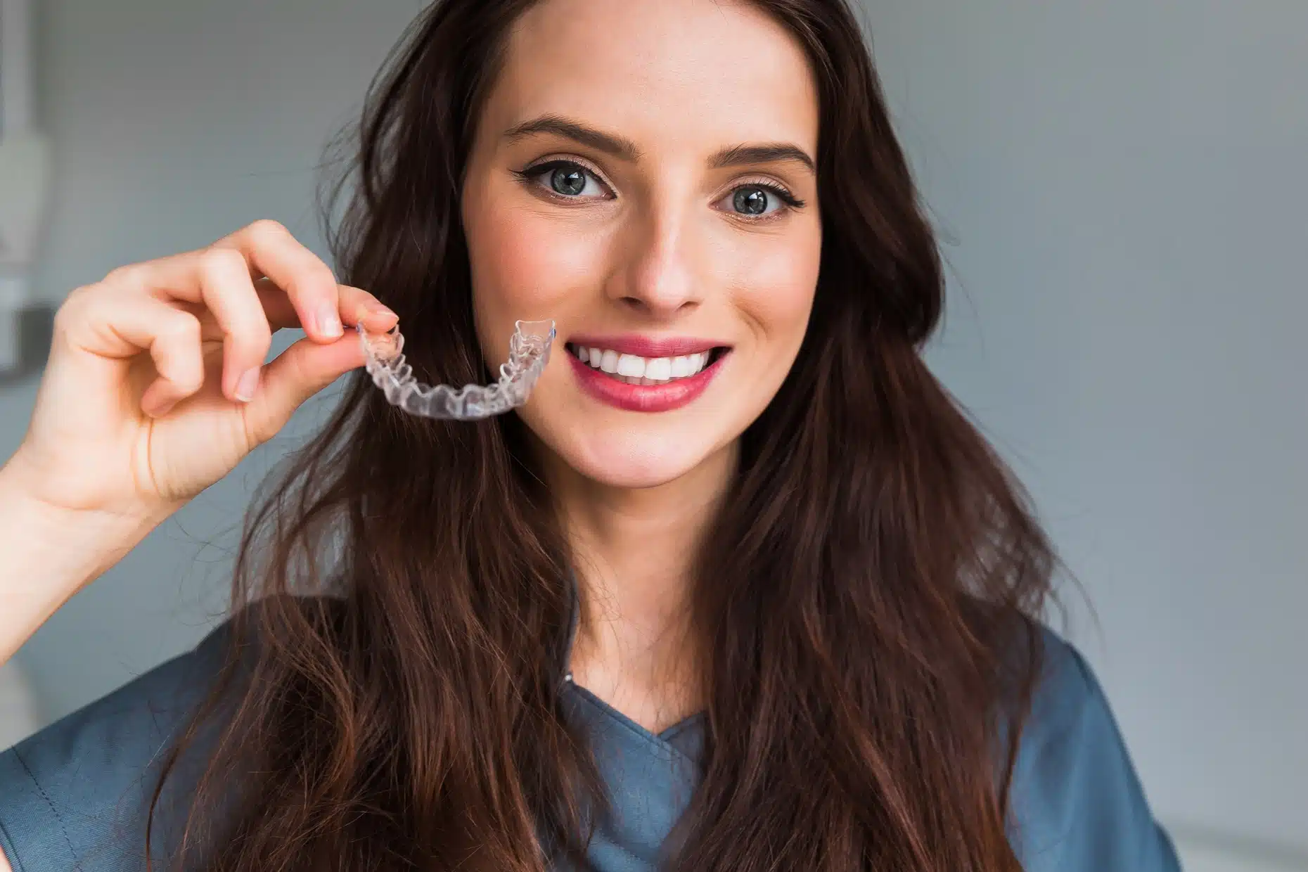 Woman wearing clear dental aligner