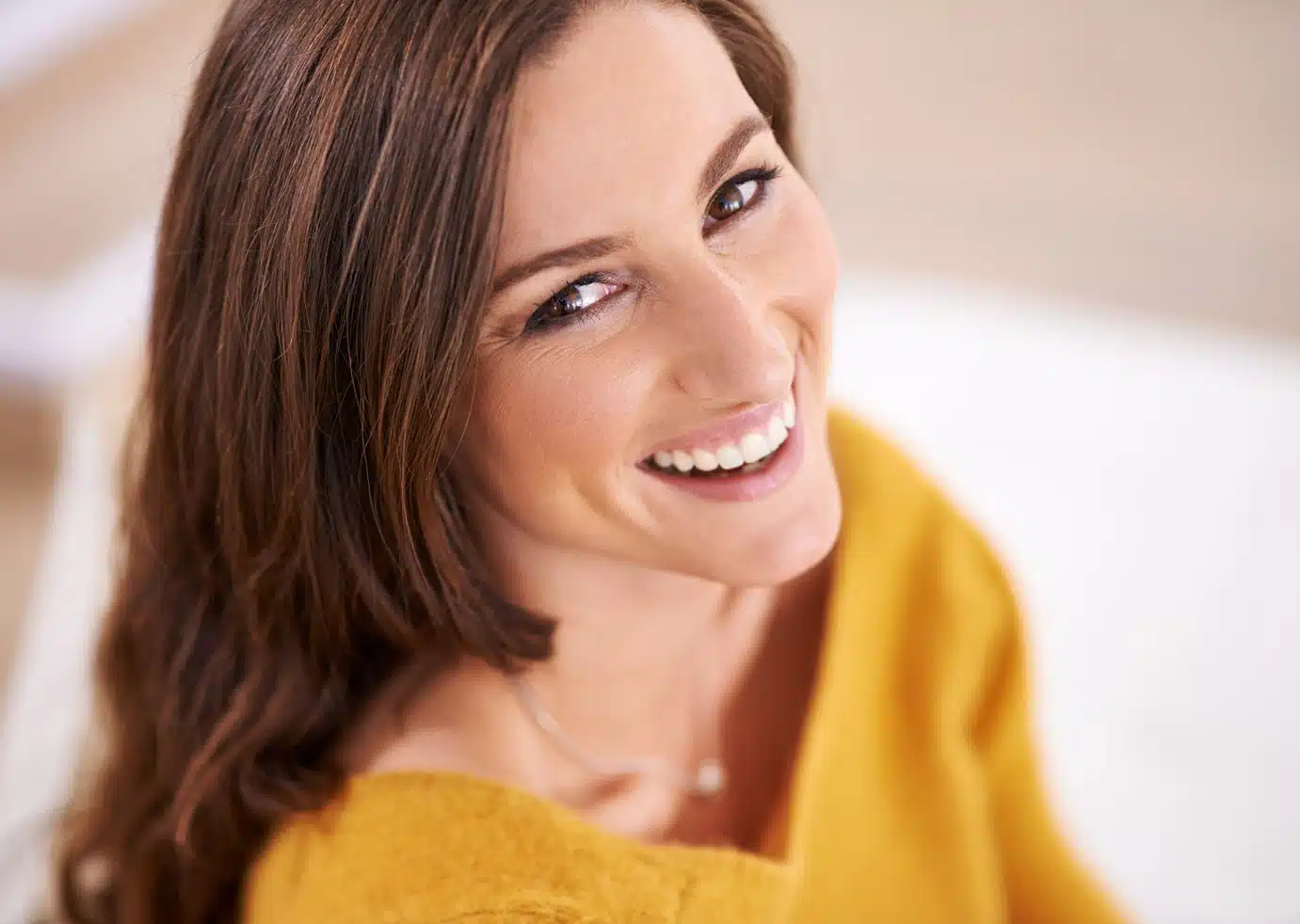 Woman smiling with a bright, confident smile