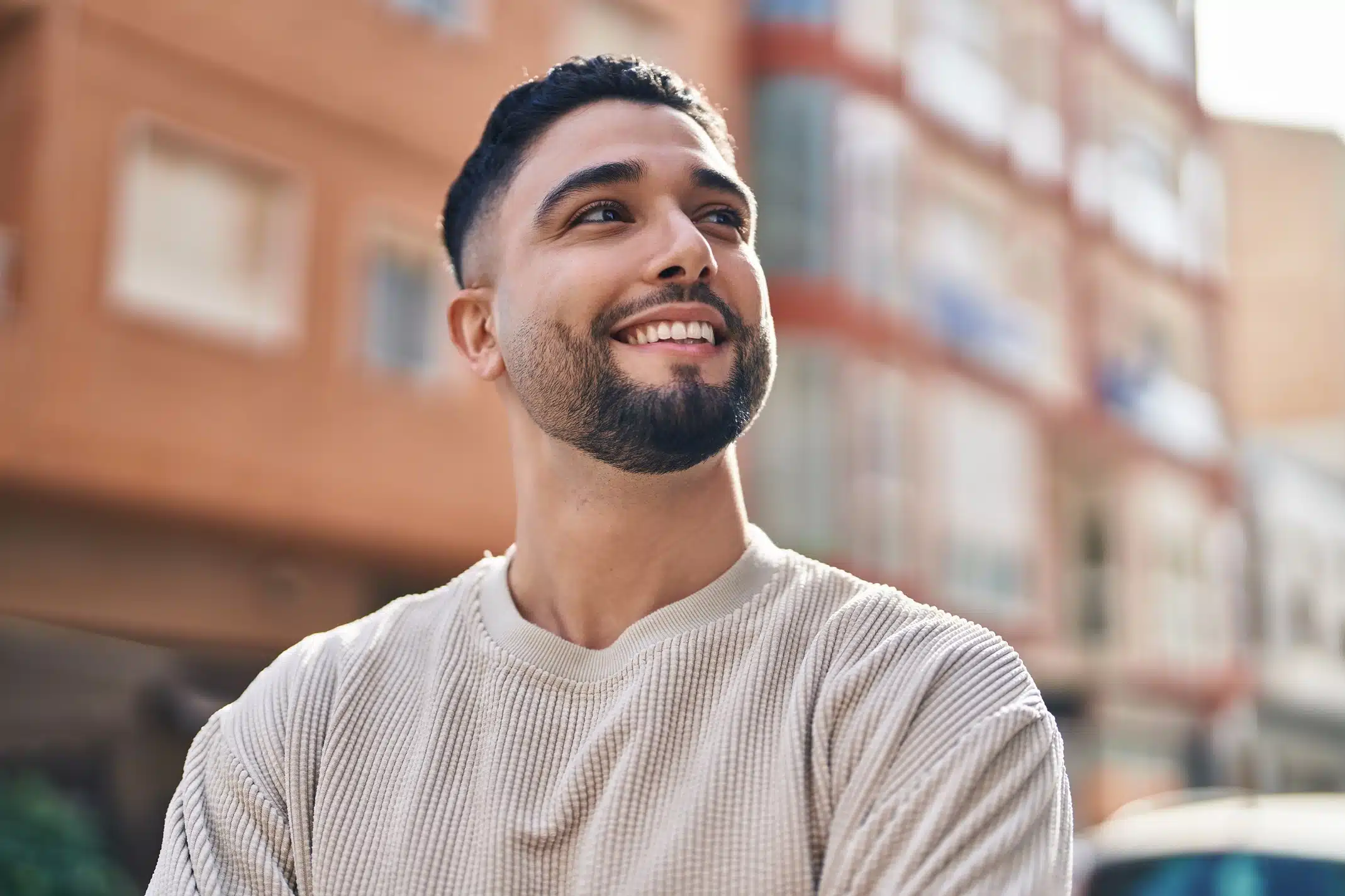 Man smiling while enjoying time outdoors