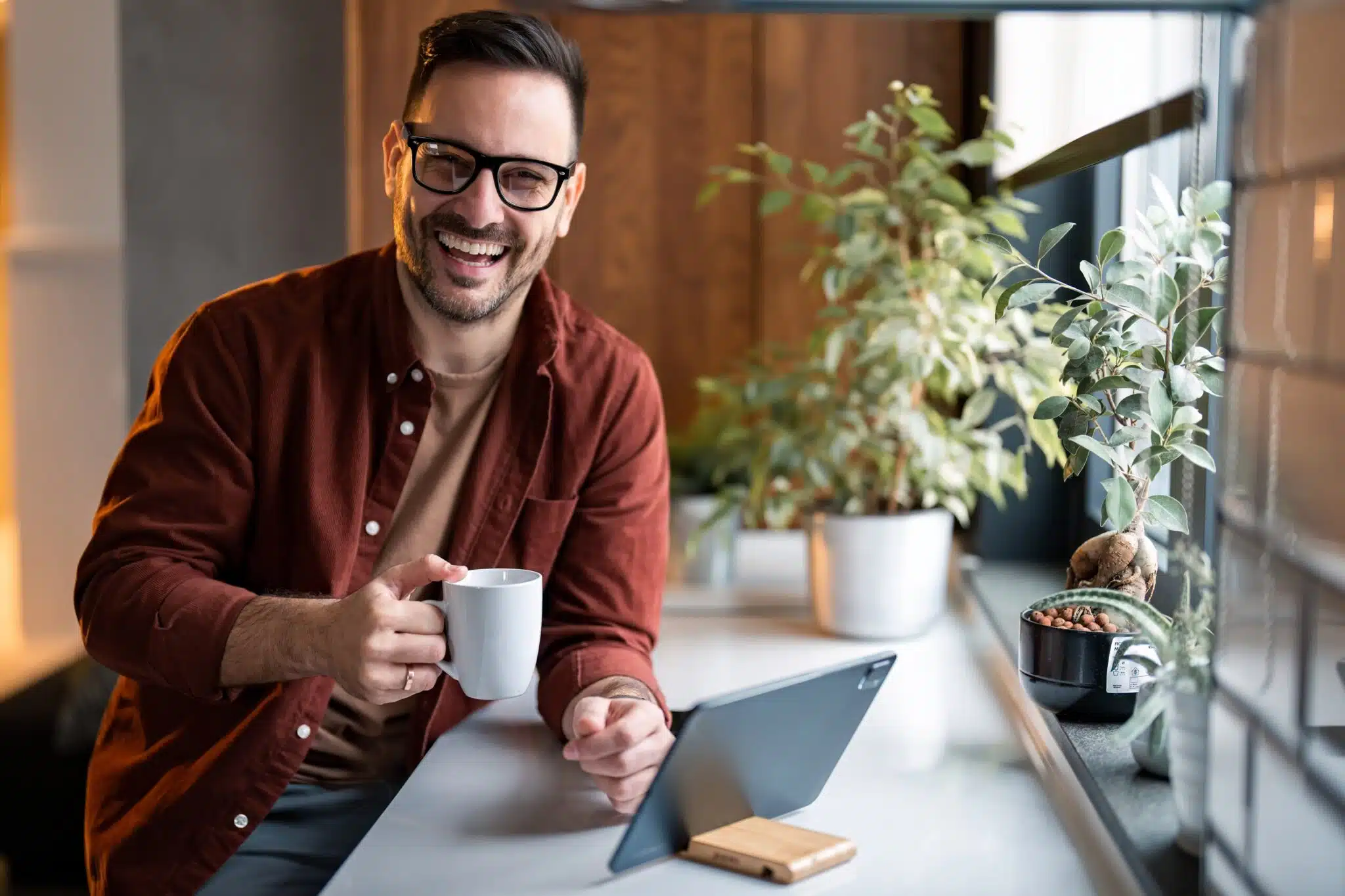 Man smiling while working at home
